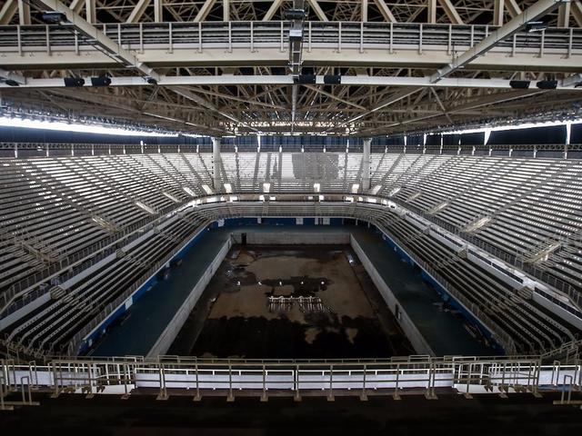 inside-the-stadium-is-deserted-puddles-of-stagnant-water-cover-the-floors-creating-a-breeding-ground-for-mosquitoes.jpg